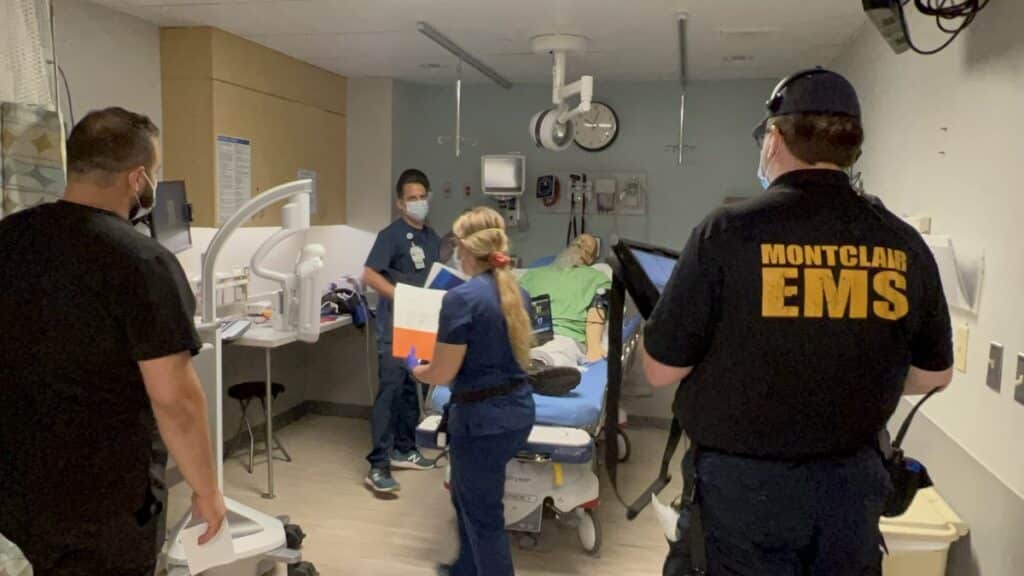 EMS workers attending a dummy patient